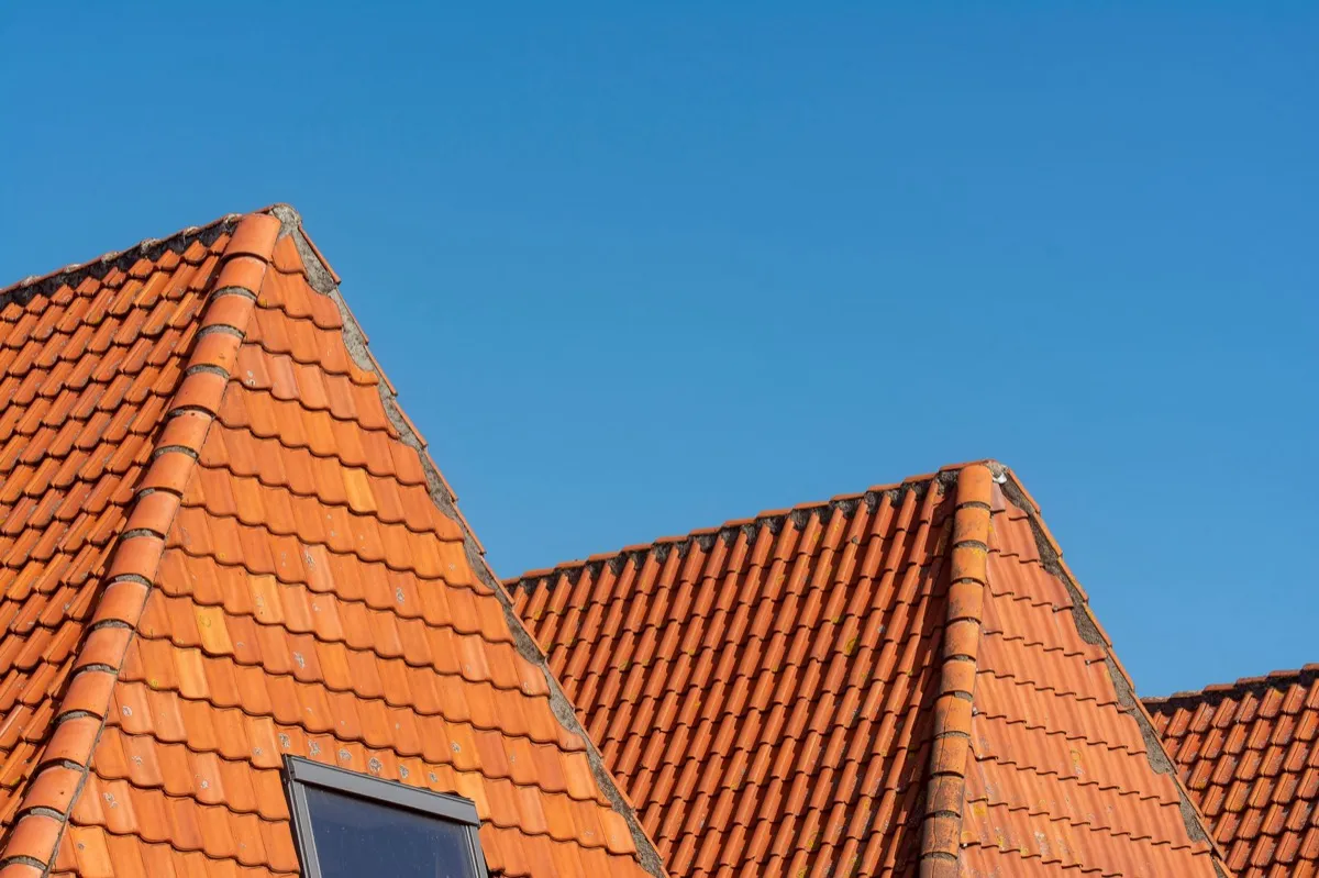 Clay barrel tile rooflines on homes in Portland, ME