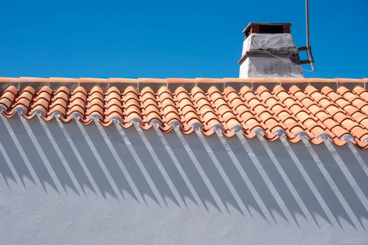 Roof ridge line and chimney on a home in Portland, ME
