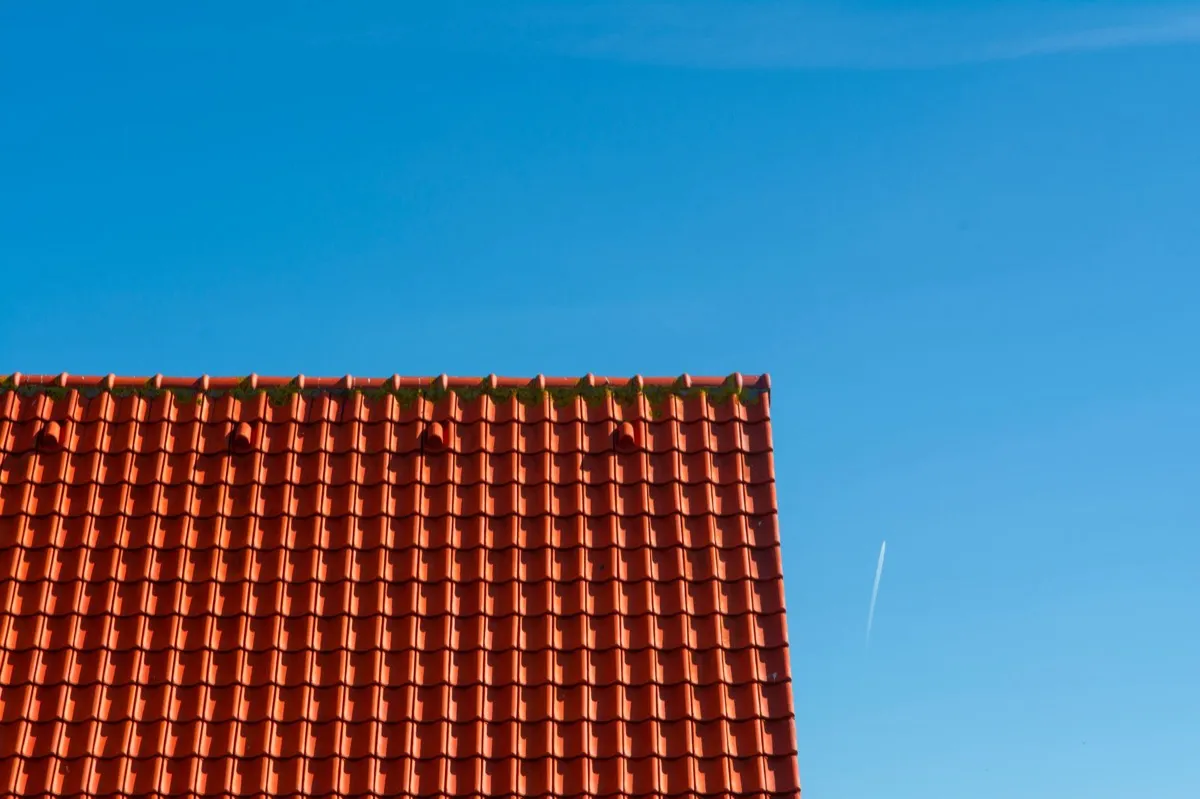 Tile roof gable in full sun, the kind of exposure that sets roof life in Portland, ME